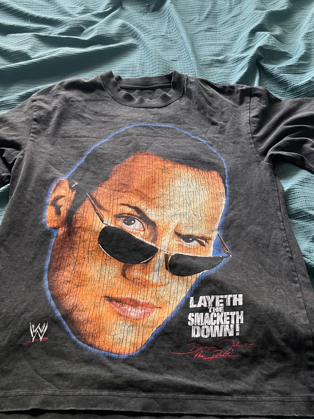 WWE Black Short Sleeve Tee with Large Orange Face Graphic and Blue Outline